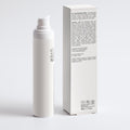 White skincare product bottle and box on a light gray background