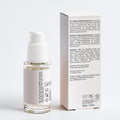 Skincare serum bottle with pump and box on a white background
