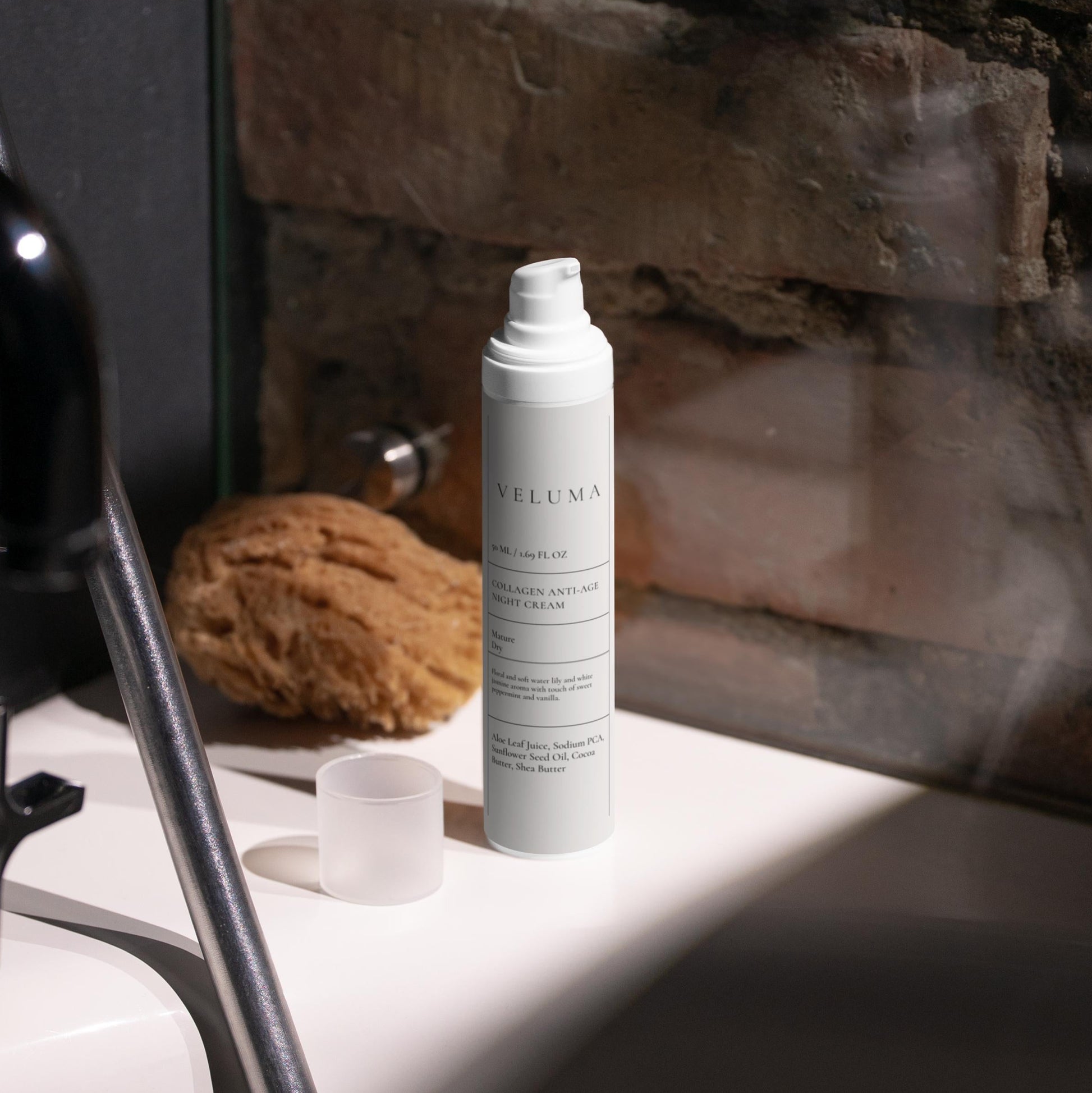 Skincare bottle on a bathroom counter with a stone wall background
