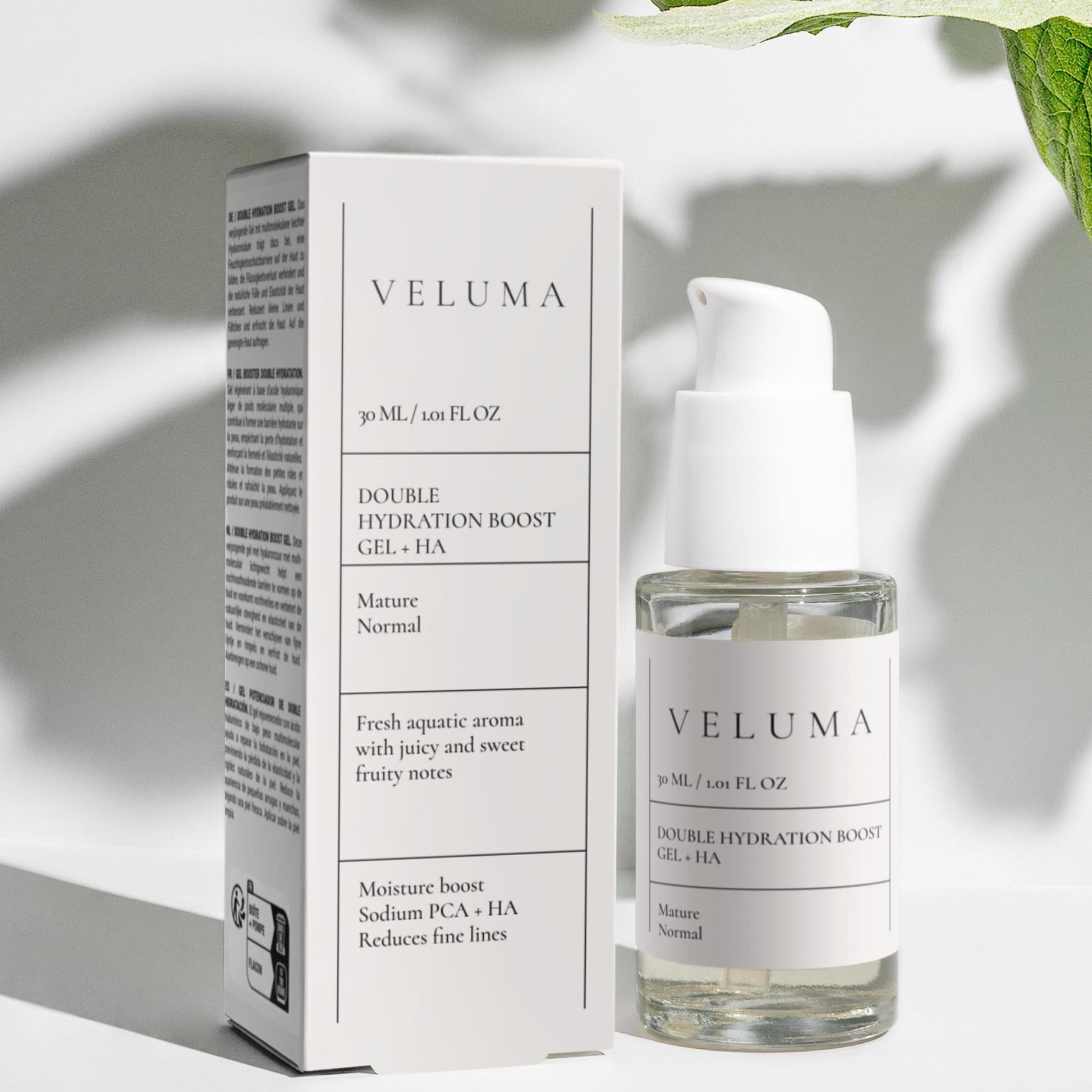 Veluma skincare product and packaging on a light background with leaves.