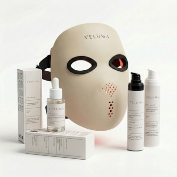 Veluma skincare products including a mask, bottles, and packaging on a white background
